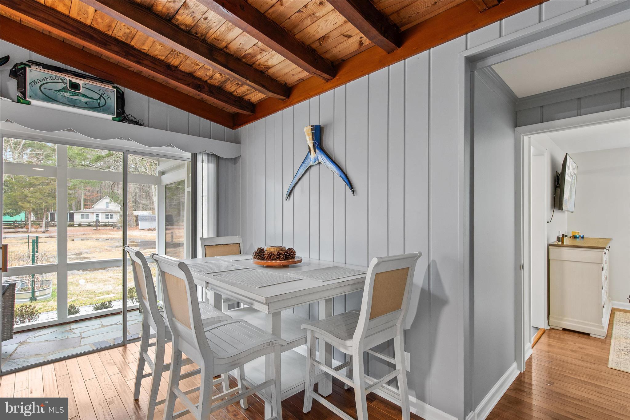 12107 Angler Road Ocean City, MD 21842 - Photo 27 of 106 a view of a dining room with furniture and wooden floor