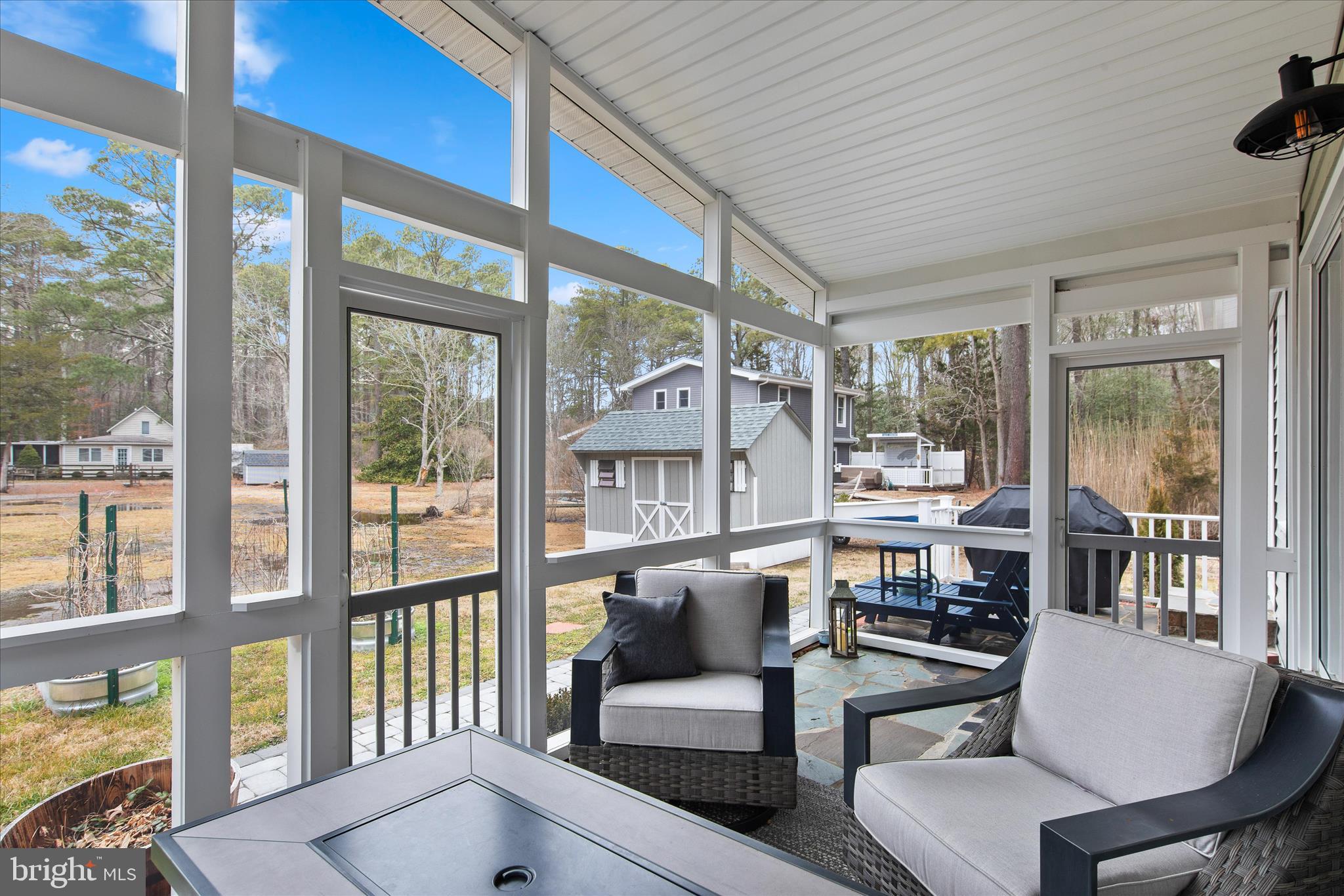 12107 Angler Road Ocean City, MD 21842 - Photo 33 of 106 a living room with furniture and a large window