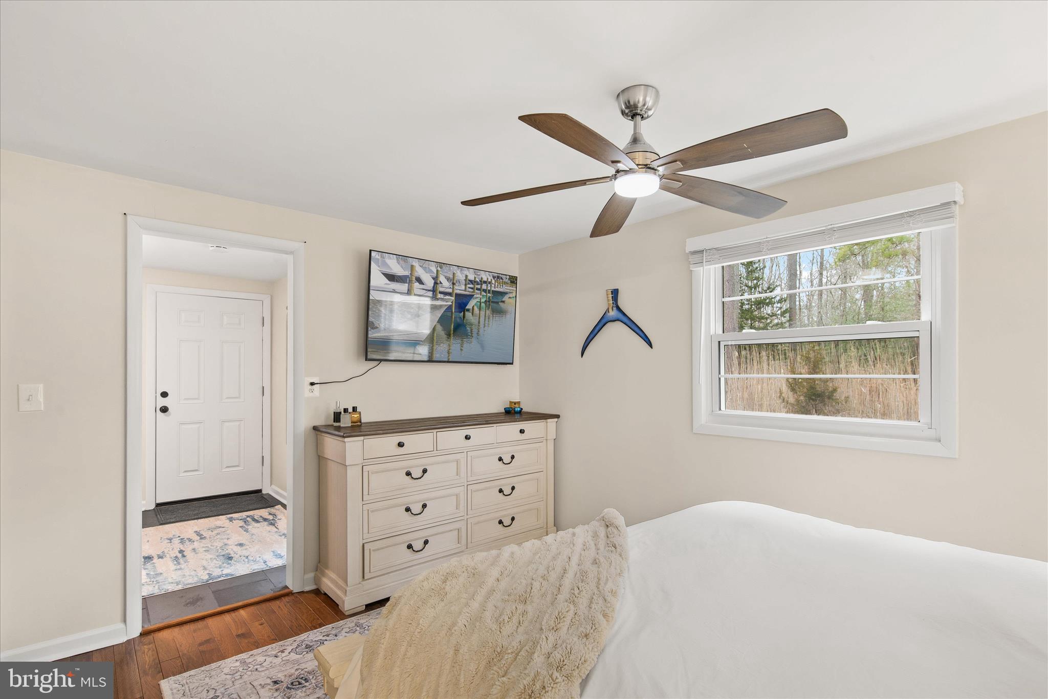 12107 Angler Road Ocean City, MD 21842 - Photo 38 of 106 a bedroom with a bed and a window