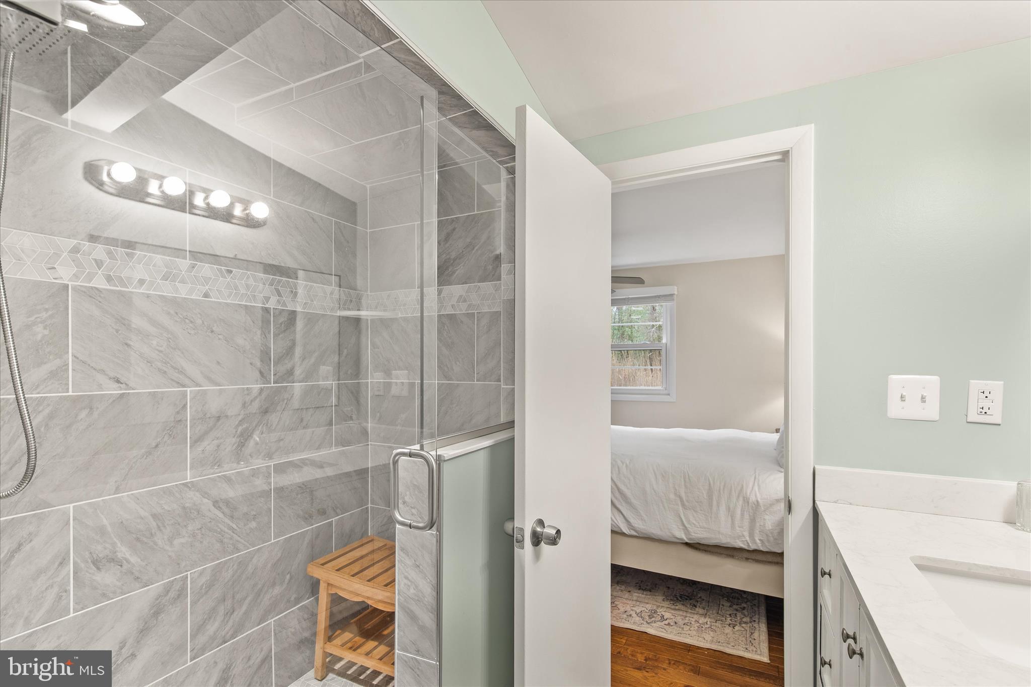 12107 Angler Road Ocean City, MD 21842 - Photo 41 of 106 a bathroom with a bathtub and a shower