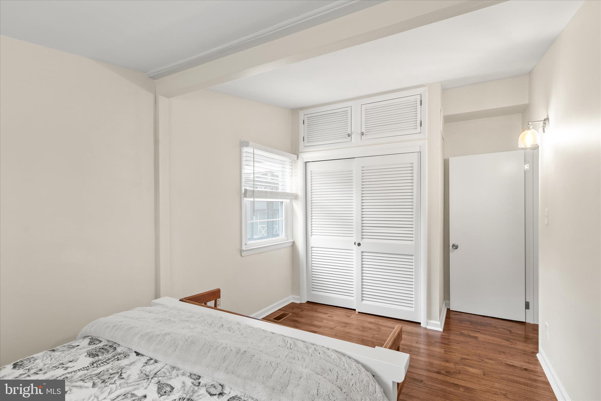 12107 Angler Road Ocean City, MD 21842 - Photo 47 of 106 a bedroom with a bed and a window