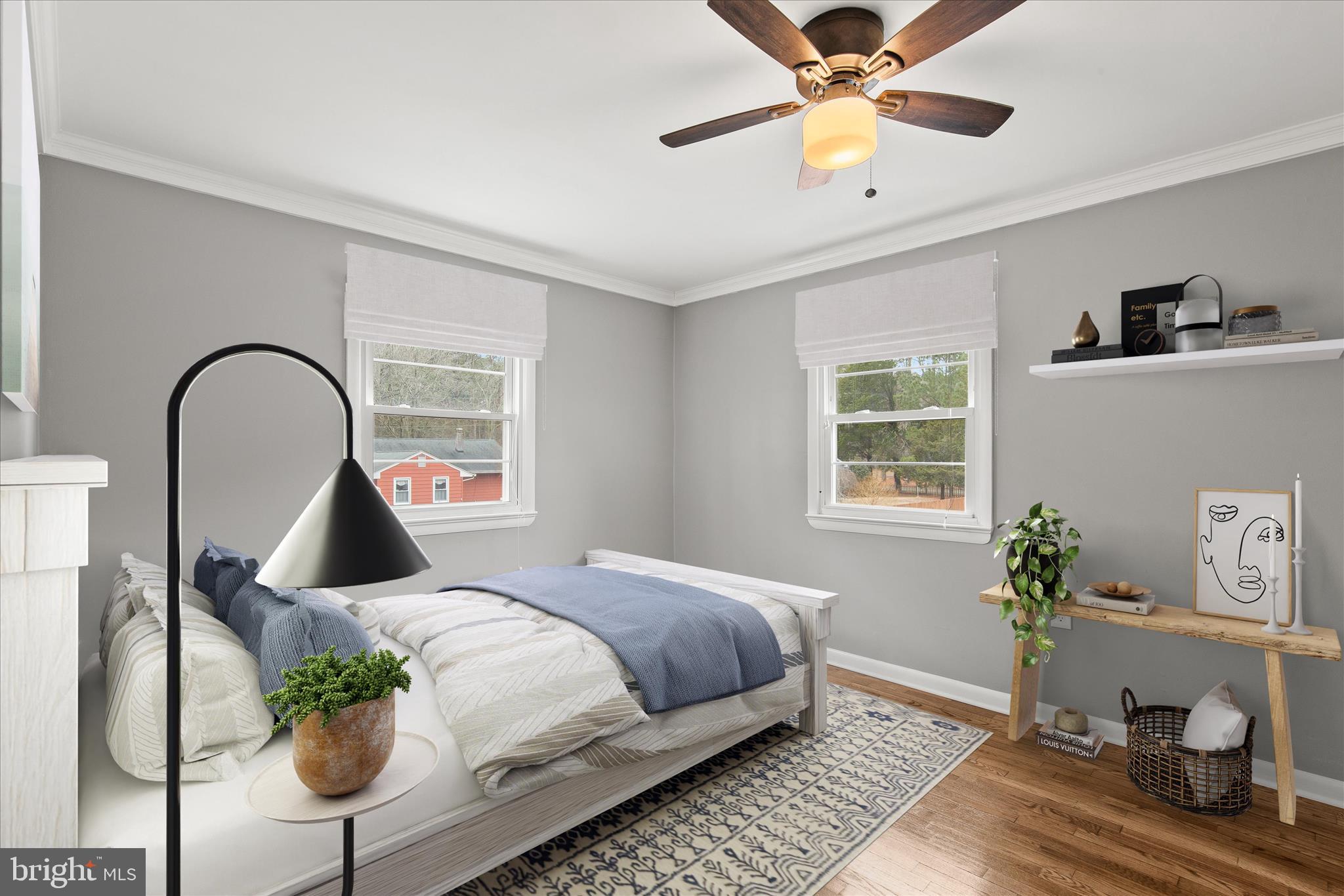 12107 Angler Road Ocean City, MD 21842 - Photo 69 of 106 a bedroom with a bed and a potted plant