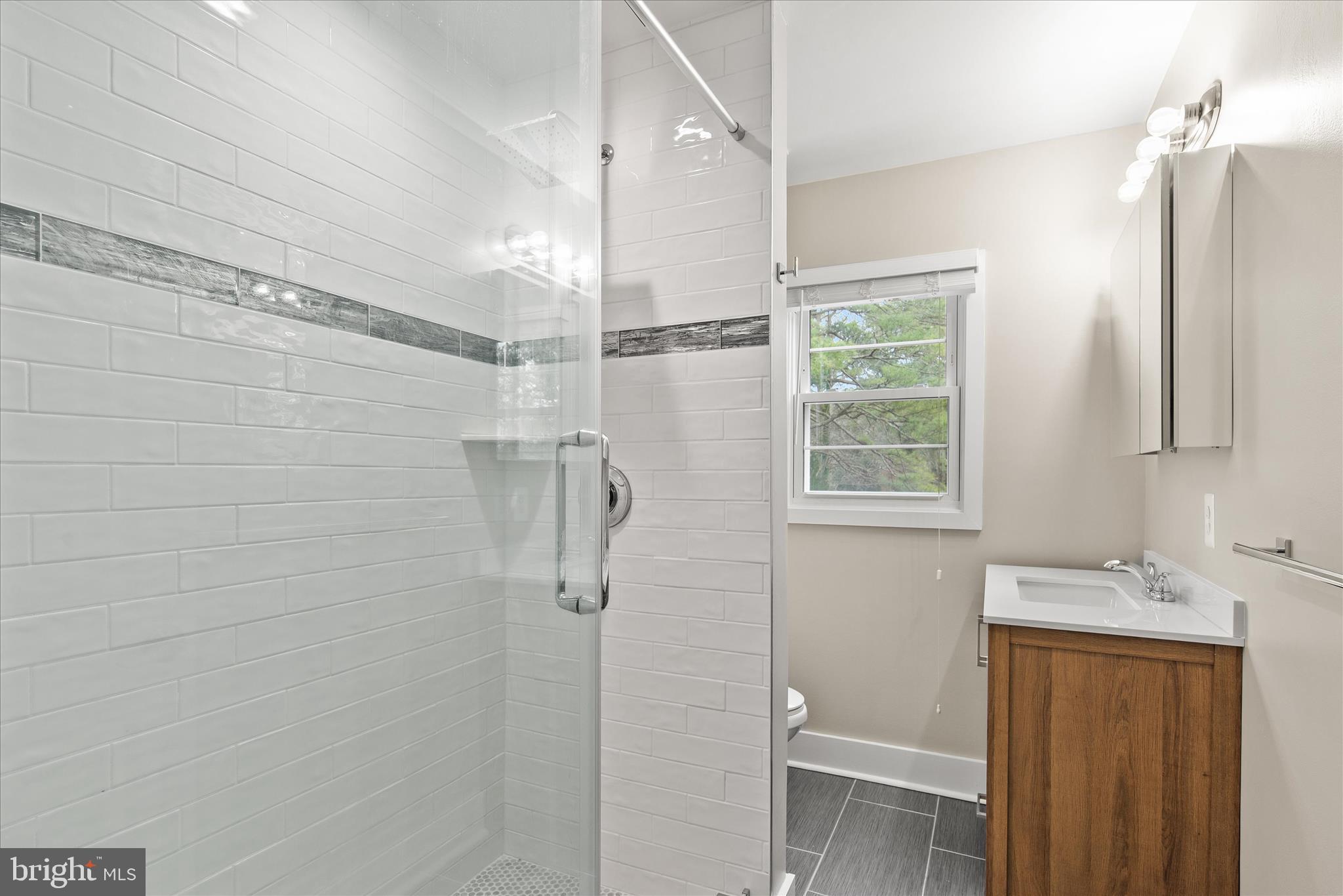 12107 Angler Road Ocean City, MD 21842 - Photo 71 of 106 a bathroom with a shower and a sink
