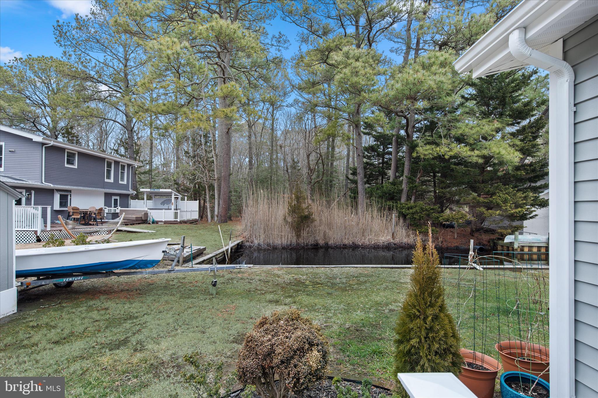 12107 Angler Road Ocean City, MD 21842 - Photo 82 of 106 a swimming pool with outdoor seating and yard