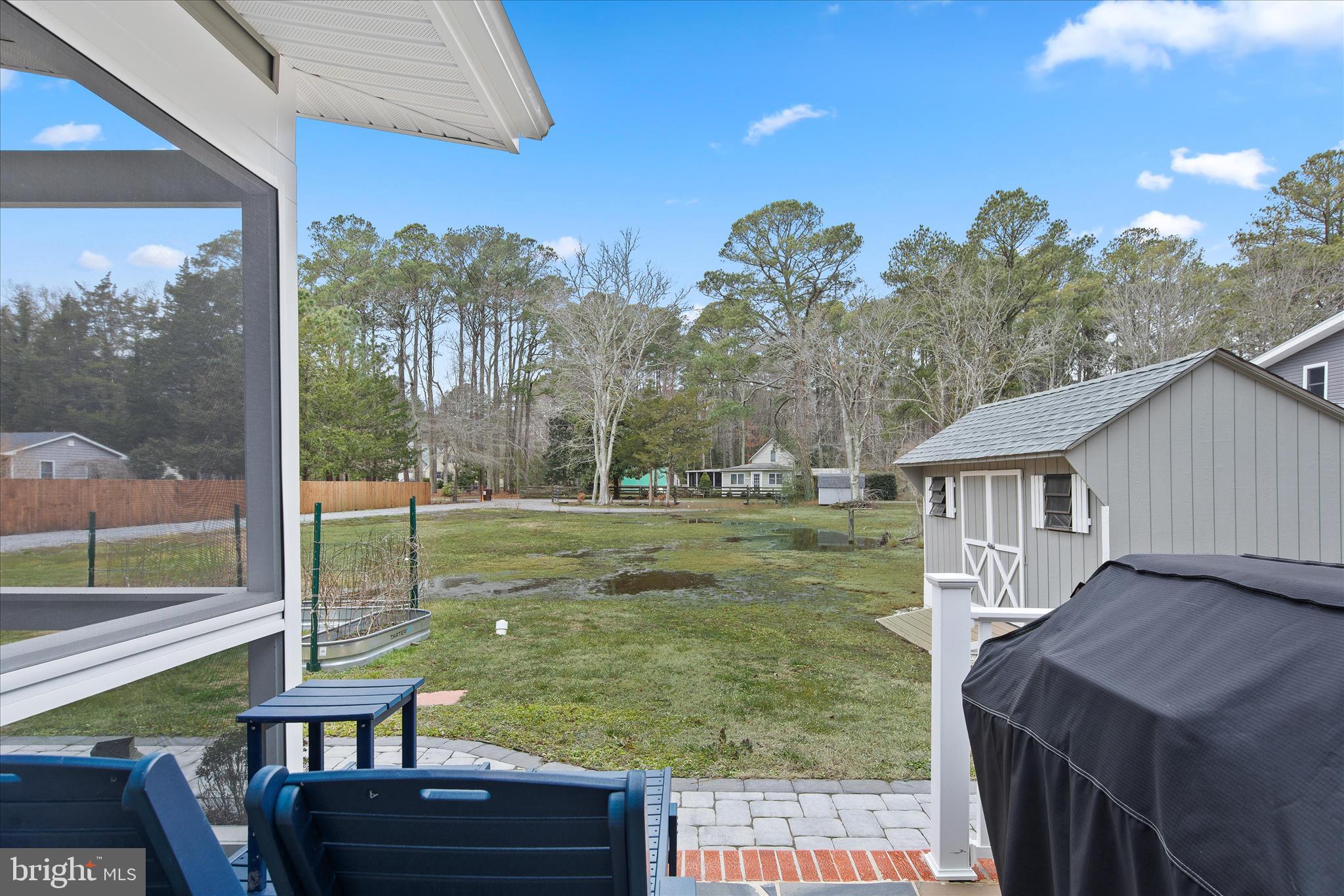 12107 Angler Road Ocean City, MD 21842 - Photo 83 of 106 a view of a porch with furniture and a yard