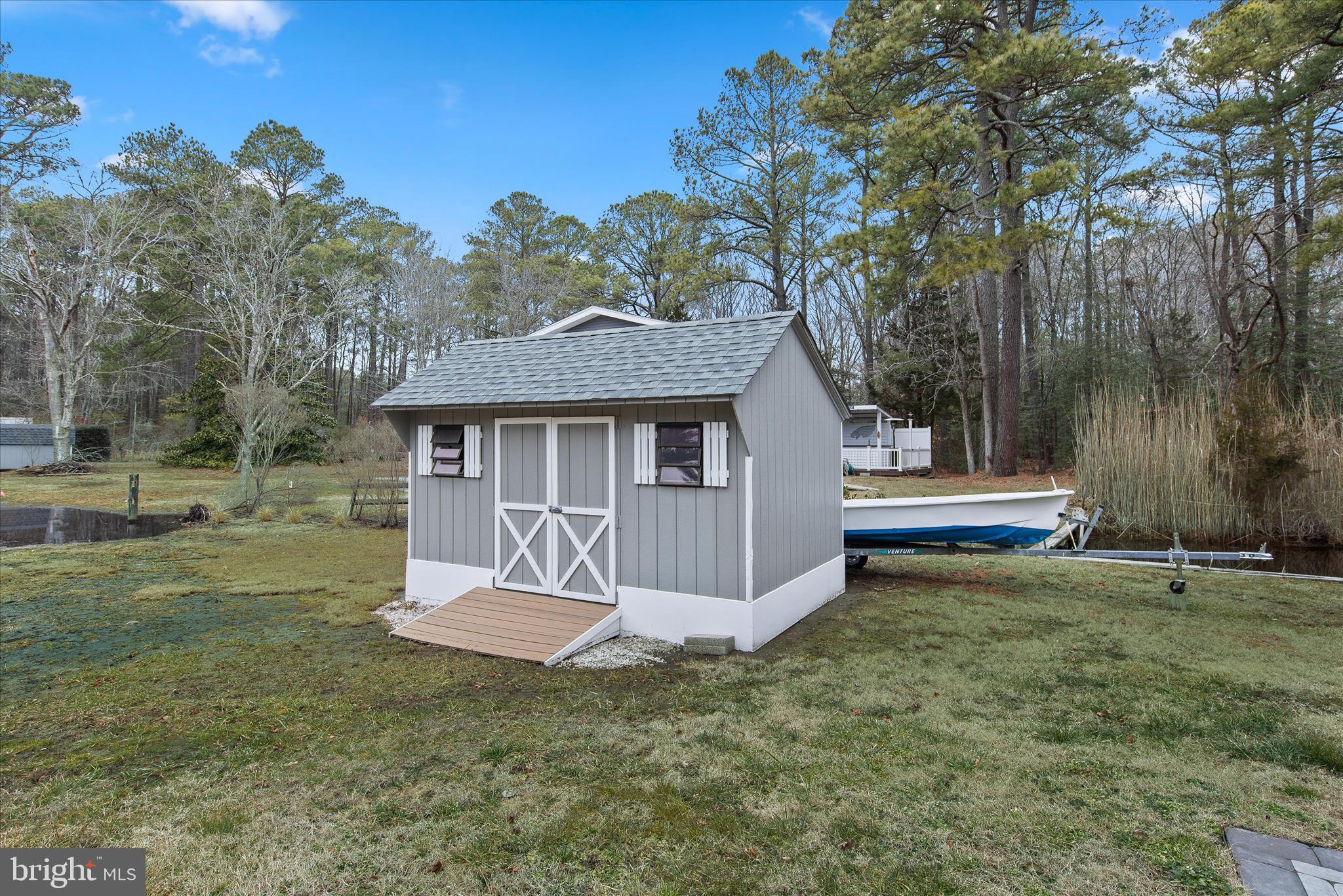 12107 Angler Road Ocean City, MD 21842 - Photo 87 of 106 a view of a house with a yard