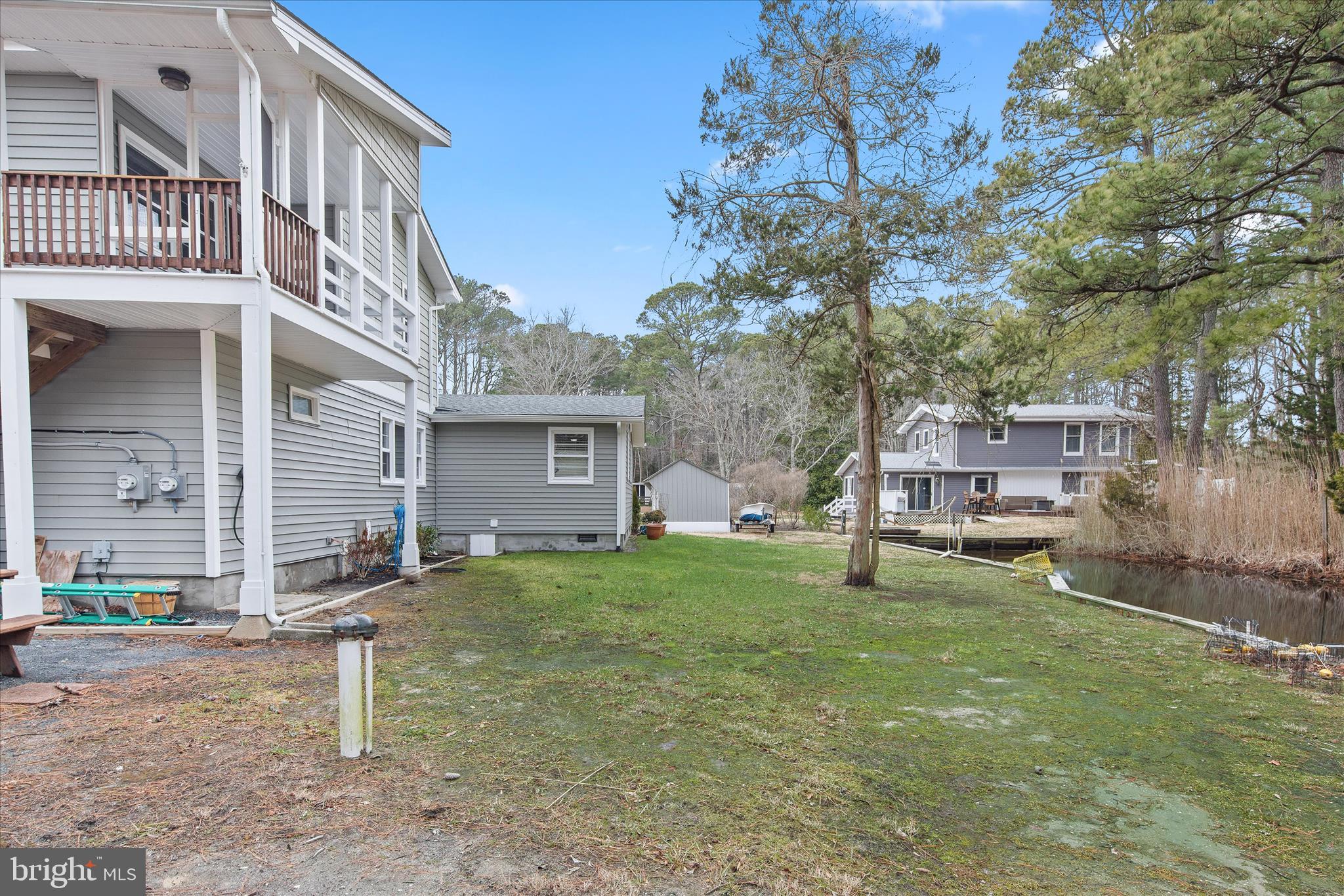 12107 Angler Road Ocean City, MD 21842 - Photo 92 of 106 front view of a house with a yard