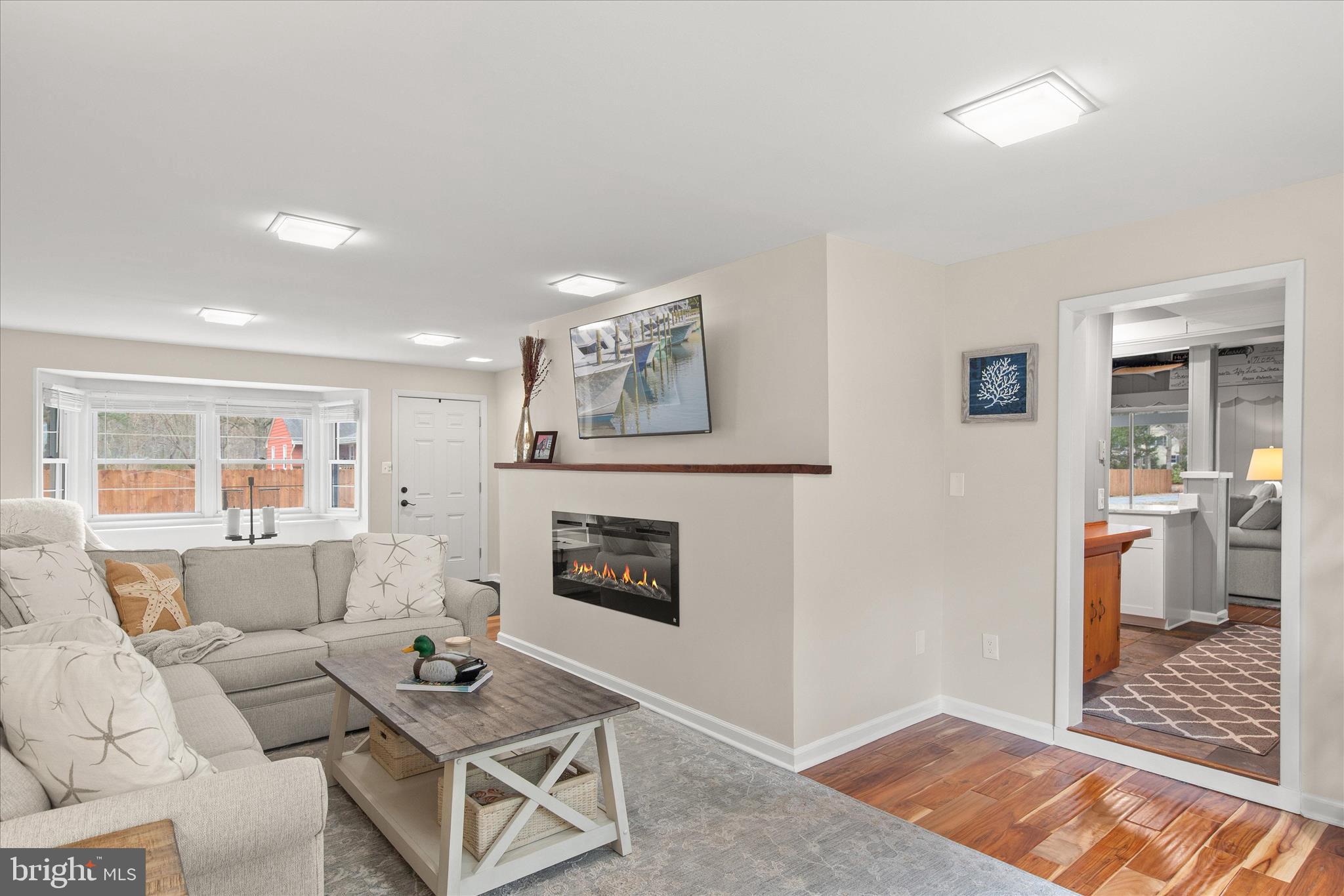 12107 Angler Road Ocean City, MD 21842 - Photo 10 of 106 a living room with furniture and a fireplace