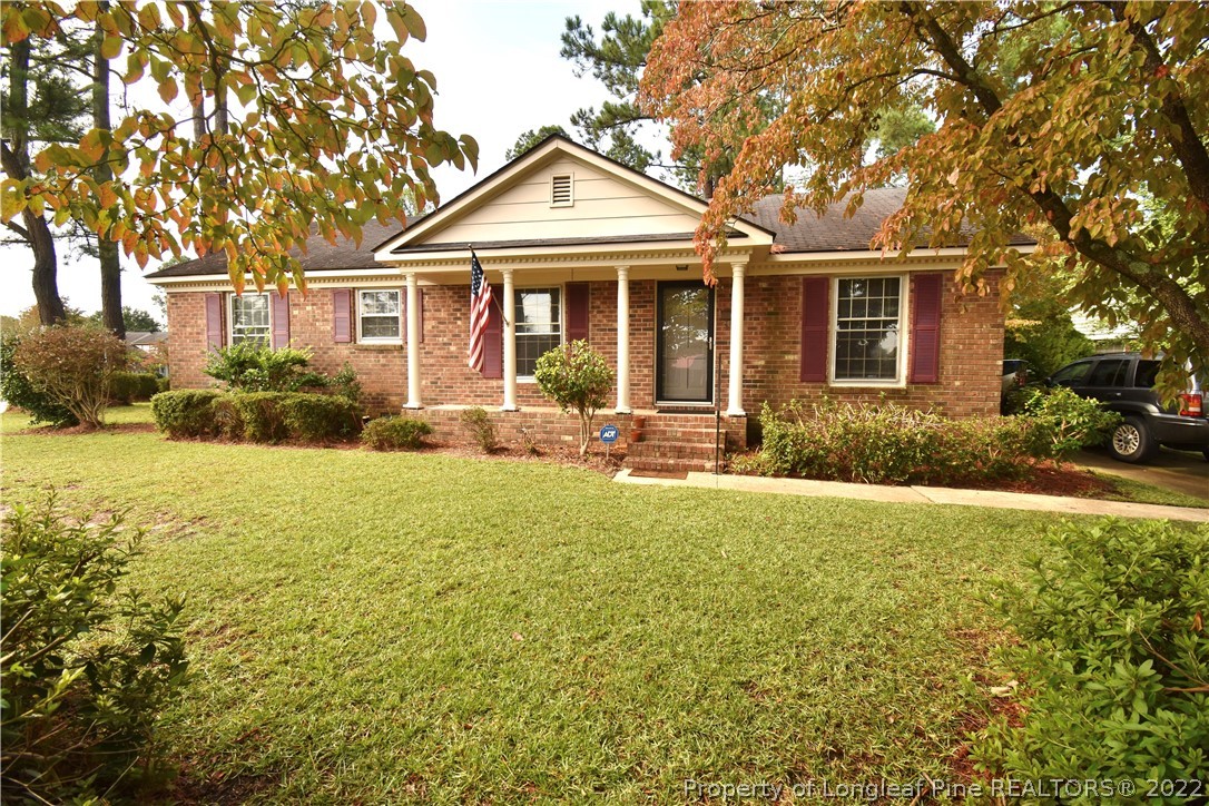 5401 Chesapeake Road Fayetteville, NC 28311 - Photo 1 of 17 a front view of a house with yard and green space