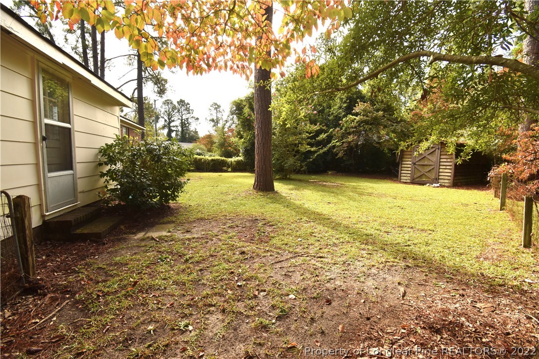5401 Chesapeake Road Fayetteville, NC 28311 - Photo 17 of 17 a view of a yard with an trees