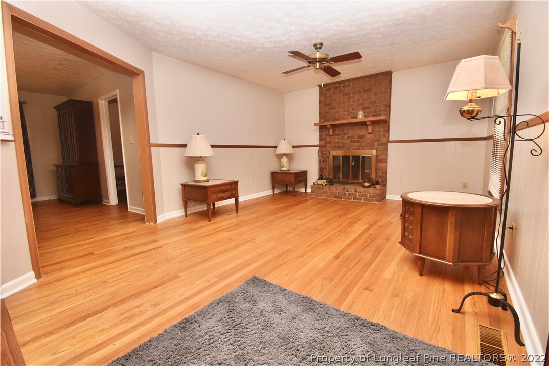 5401 Chesapeake Road Fayetteville, NC 28311 - Photo 4 of 17 a room with wooden floor and furniture