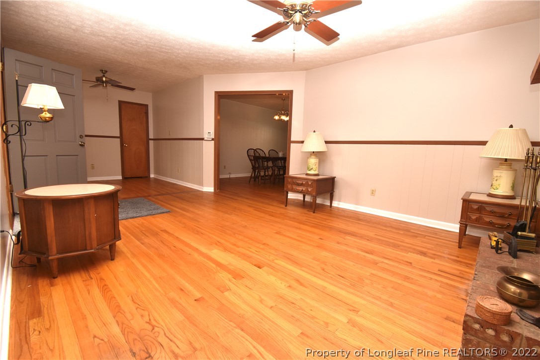 5401 Chesapeake Road Fayetteville, NC 28311 - Photo 5 of 17 a view of a room with furniture and wooden floor