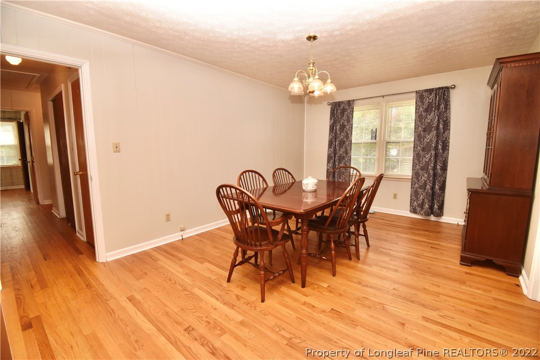 5401 Chesapeake Road Fayetteville, NC 28311 - Photo 6 of 17 a view of a dining room with furniture and wooden floor