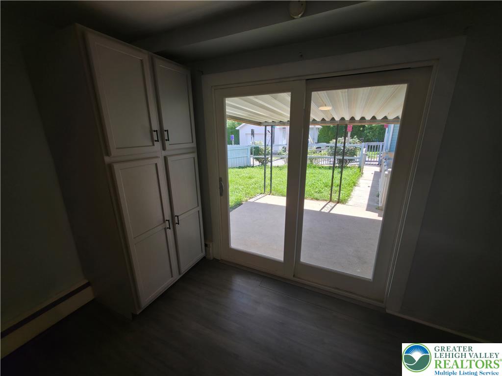 719 Keystone Avenue Bethlehem, PA 18018 - Photo 20 of 32 Sliding doors open to an inviting exterior patio, perfect for enjoying outdoor moments.