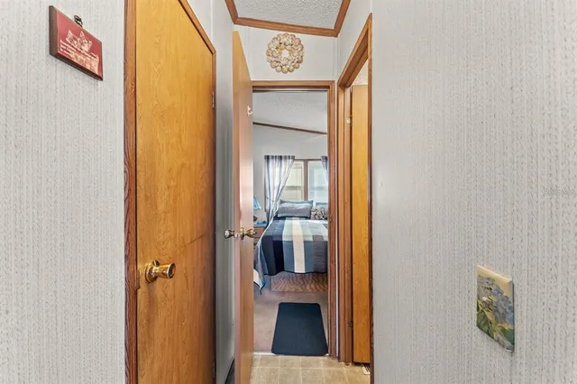 a view of hallway with wooden floor