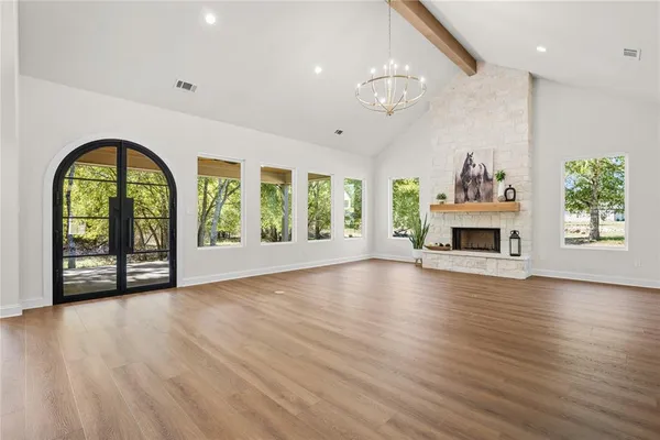 a view of room with furniture and wooden floor