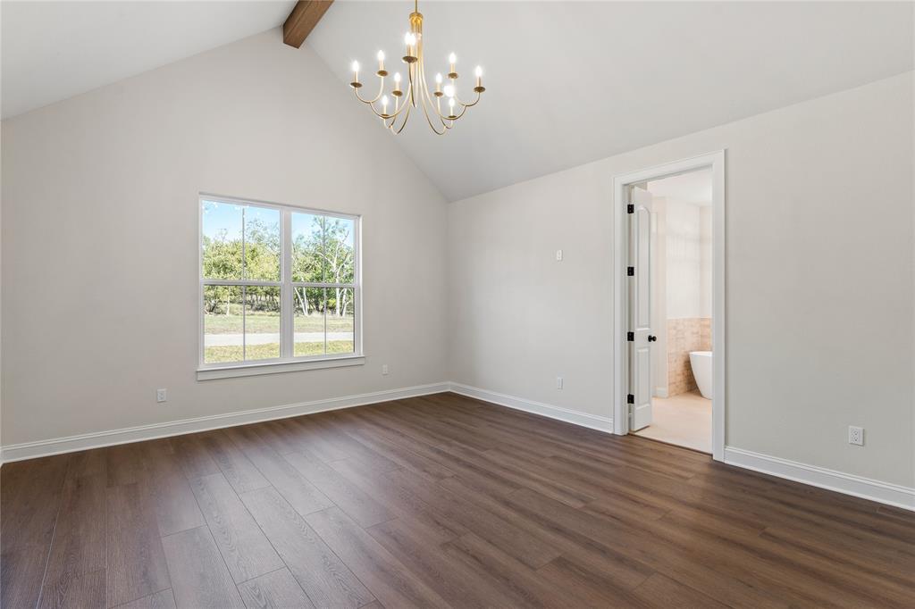 152 North Big Red Way China Spring, TX 76633 - Photo 17 of 31 a view of an empty room with wooden floor and a window