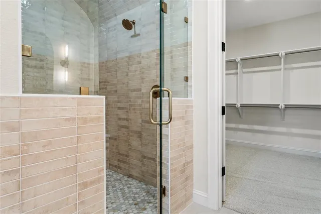 a bathroom with a bathtub and shower