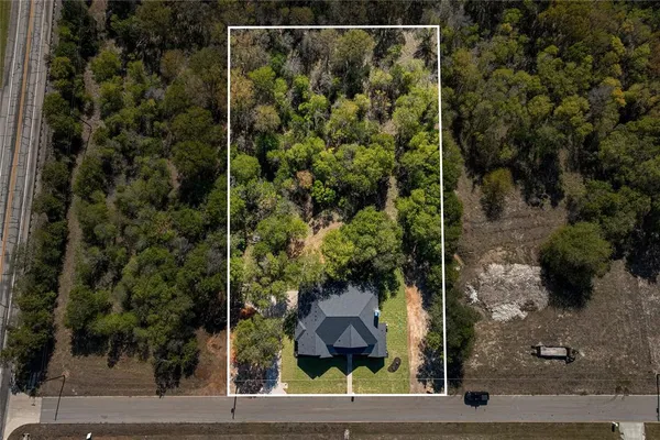 an aerial view of a house with garden
