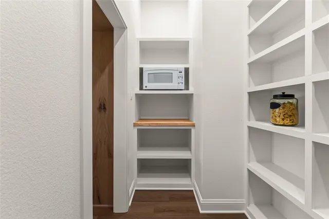 a kitchen with a stove oven and sink