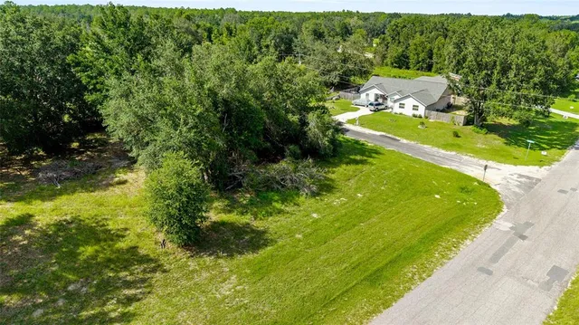 a view of a garden with a building