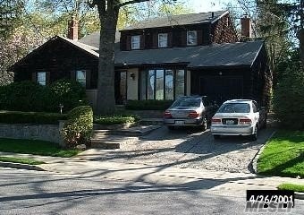 a front view of a house with yard
