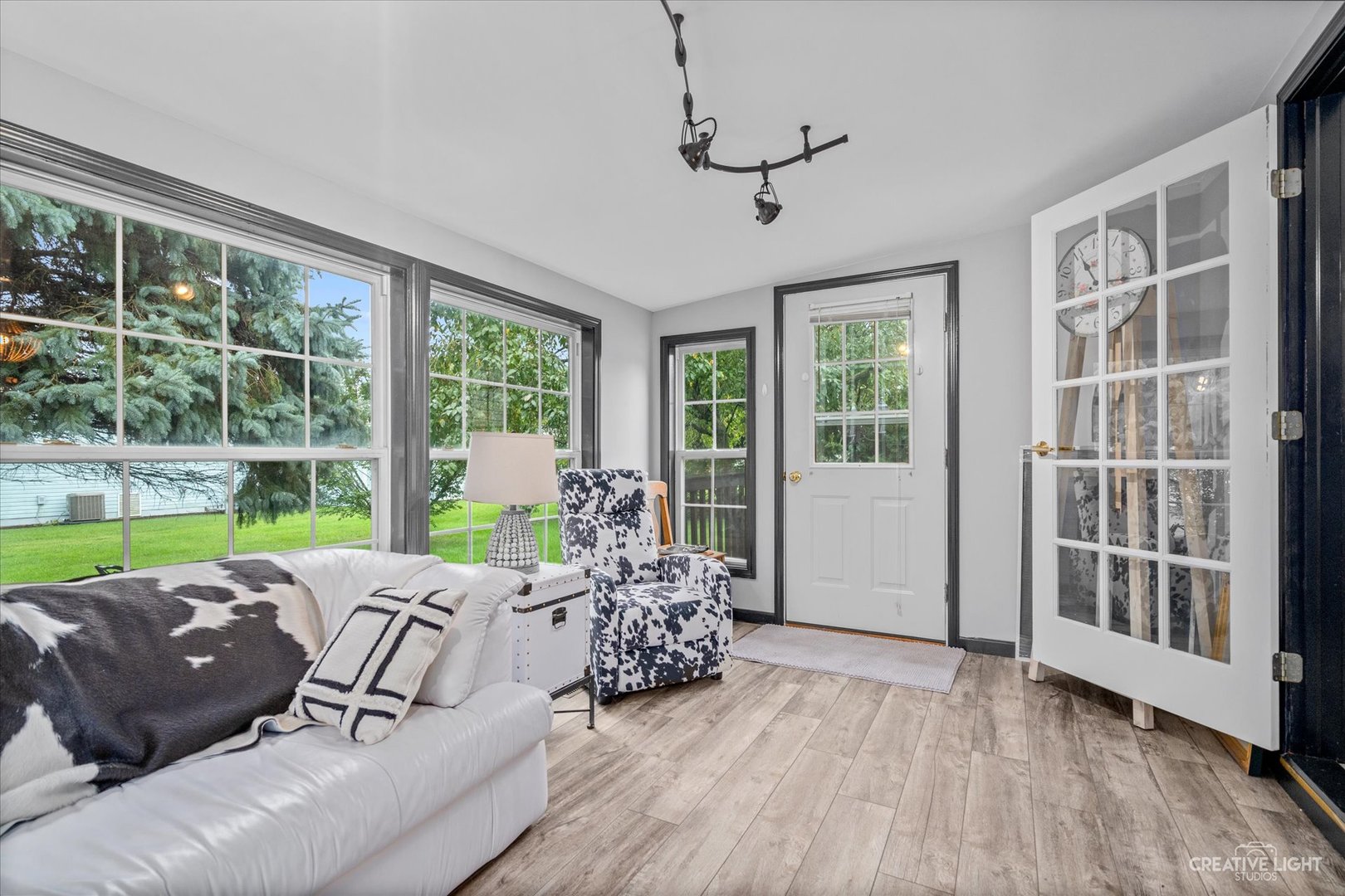 125 Cardinal Lane Sandwich, IL 60548 - Photo 11 of 21 a bed room with a bed couch and a large window