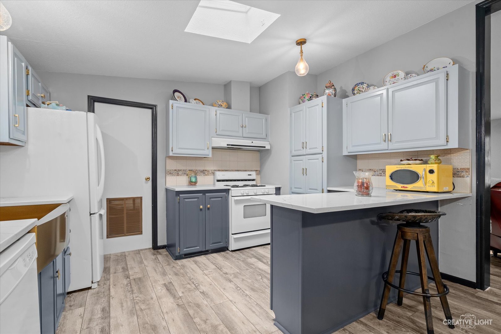 125 Cardinal Lane Sandwich, IL 60548 - Photo 12 of 21 a kitchen with a sink a stove a refrigerator and cabinets