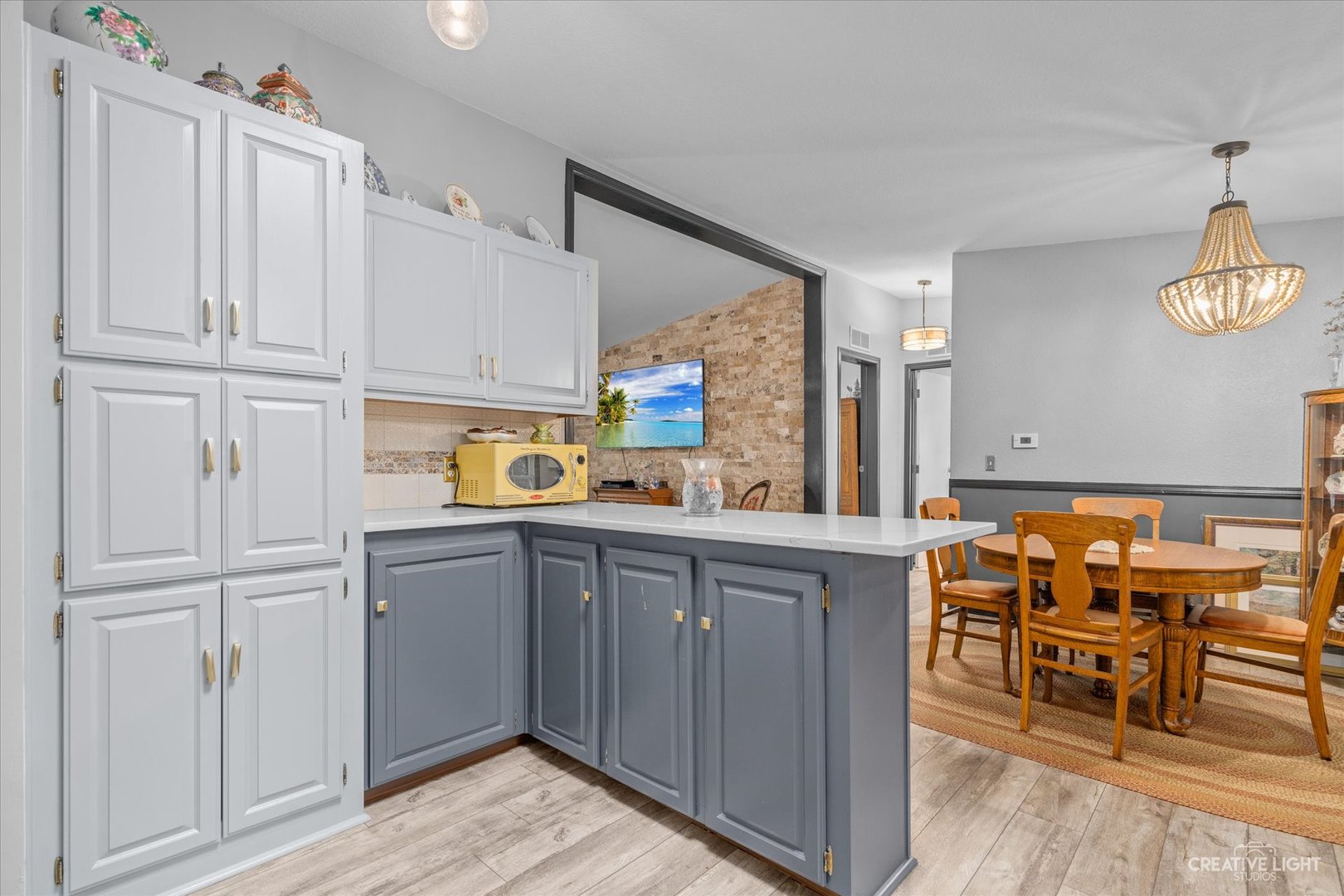 125 Cardinal Lane Sandwich, IL 60548 - Photo 13 of 21 a kitchen with cabinets and chairs