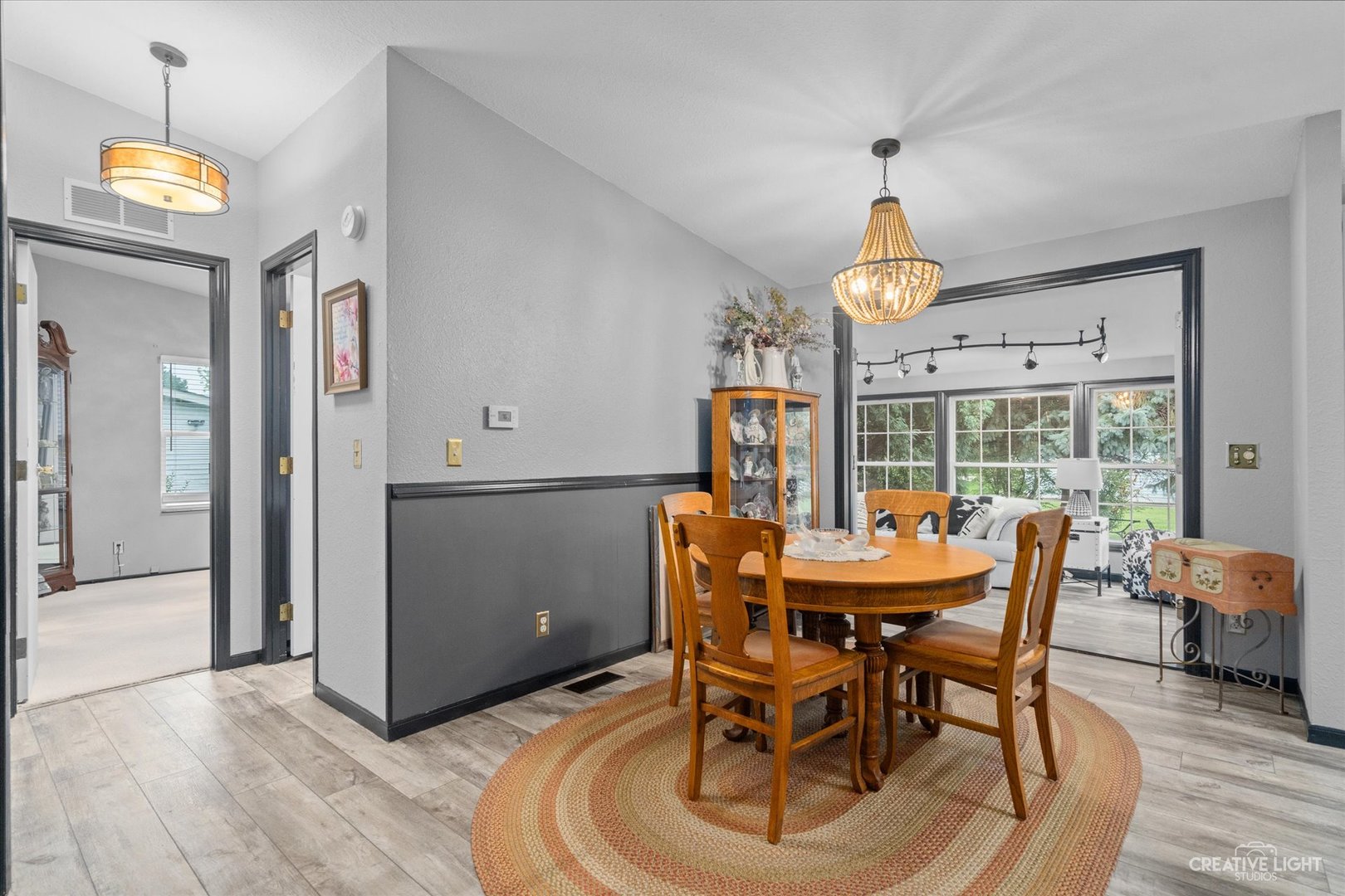 125 Cardinal Lane Sandwich, IL 60548 - Photo 8 of 21 a dining room with furniture a chandelier and wooden floor