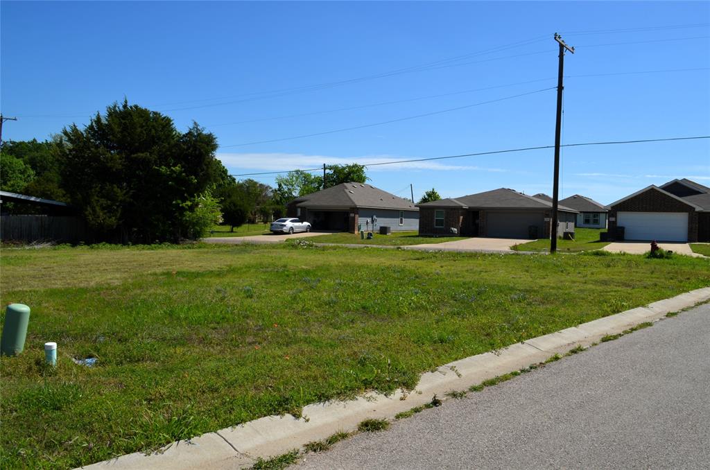 306 Preston Road Mabank, TX 75147 - Photo 1 of 6 a view of a house with a yard and sitting area