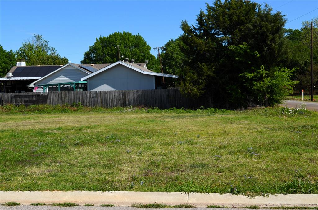 306 Preston Road Mabank, TX 75147 - Photo 4 of 6 a view of a big yard with a house in the background