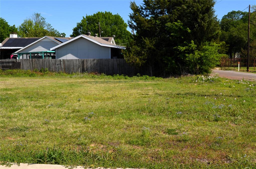 306 Preston Road Mabank, TX 75147 - Photo 6 of 6 a front view of a house with garden