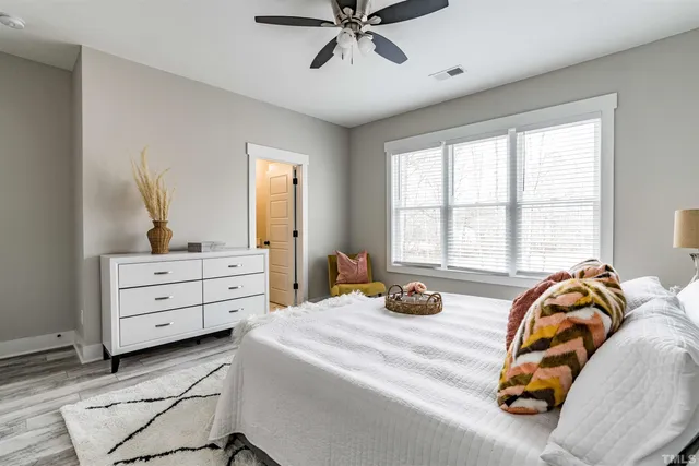 a bedroom with a bed and window