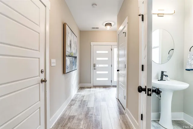 a bathroom with a sink mirror and a shower