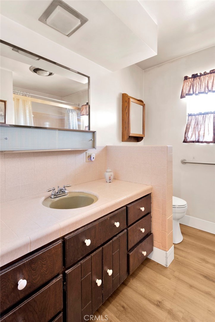 5500 Oil Well Road Phelan, CA 92371 - Photo 31 of 65 a bathroom with a double vanity sink and a mirror