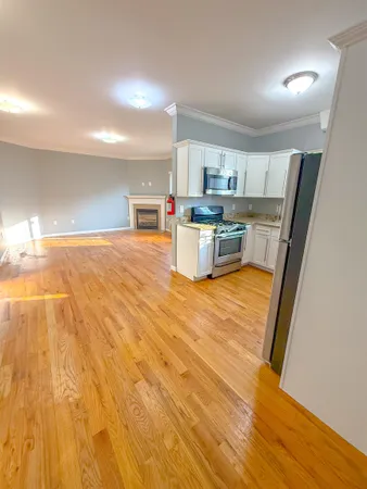 a room with a chair and appliances