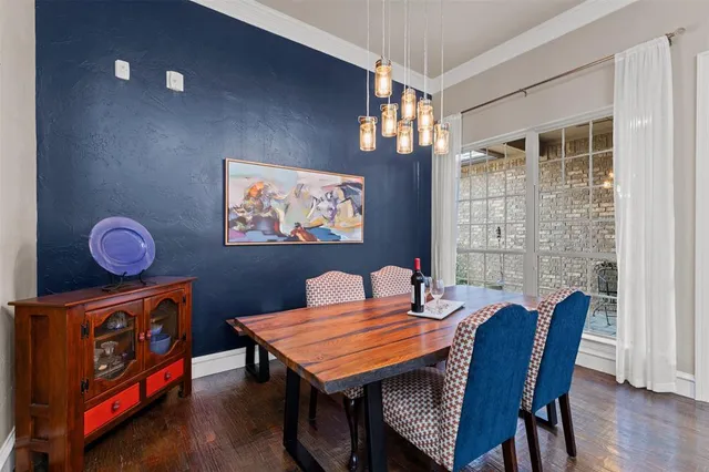 a dining room with furniture and wooden floor