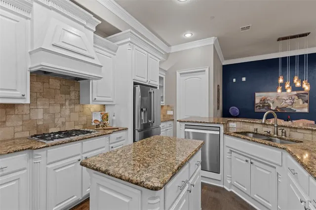 a kitchen with a sink stove and refrigerator