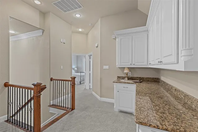 a view of a kitchen with electric appliances