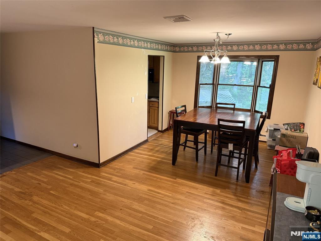36 Lavina Trail Oak Ridge, NJ 07438 - Photo 10 of 26 a view of a dining room with furniture and window