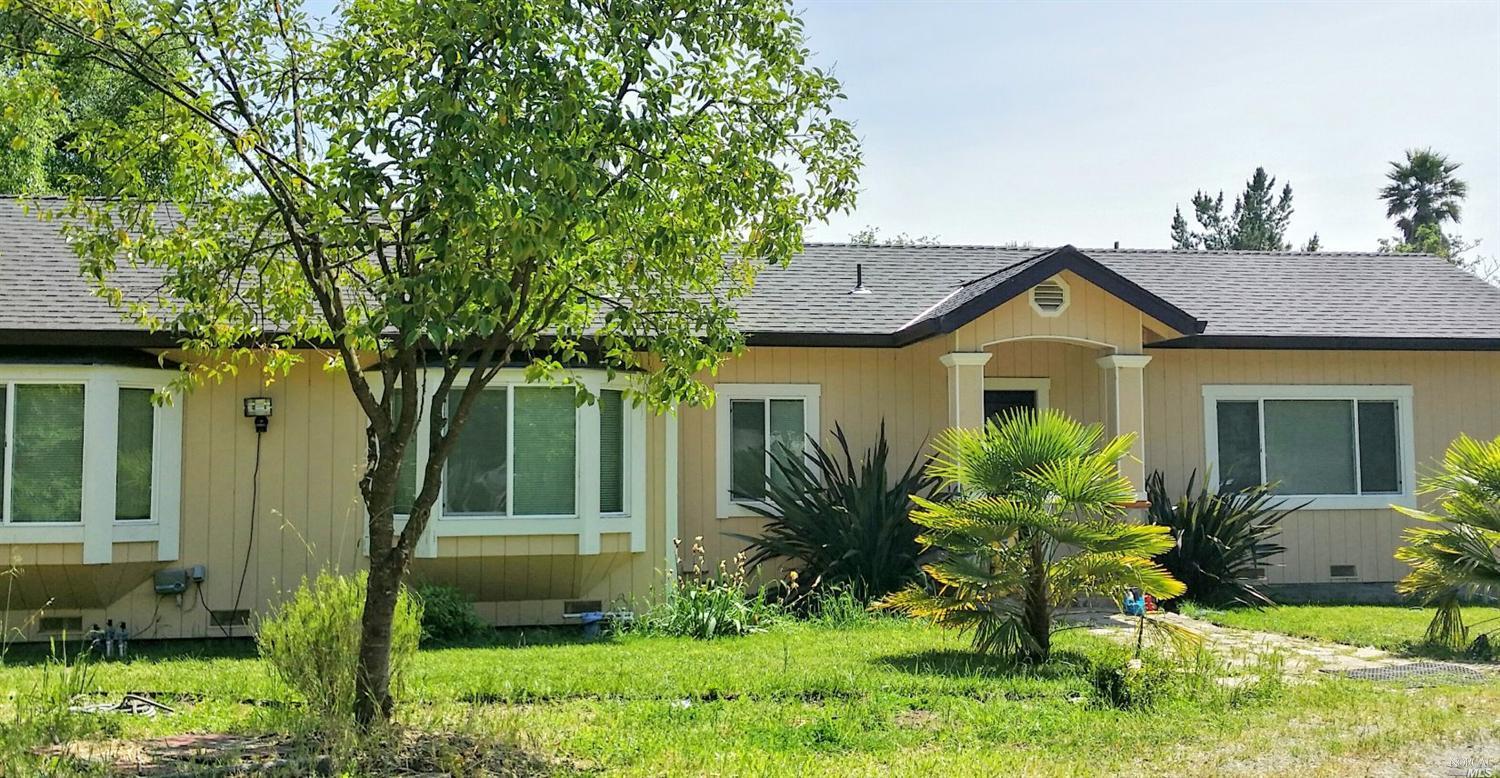 3634 Guerneville Road Santa Rosa, CA 95401 - Photo 1 of 1 a front view of a house with a yard