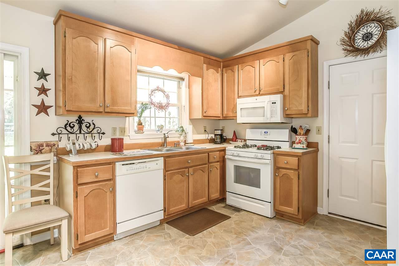 16 Bernardsburg Road Palmyra, VA 22963 - Photo 7 of 24 a kitchen with white cabinets and white appliances