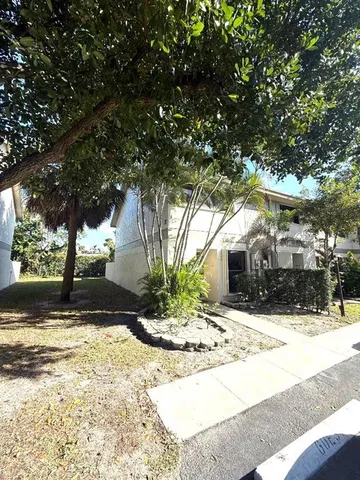 a view of a yard covered in snow