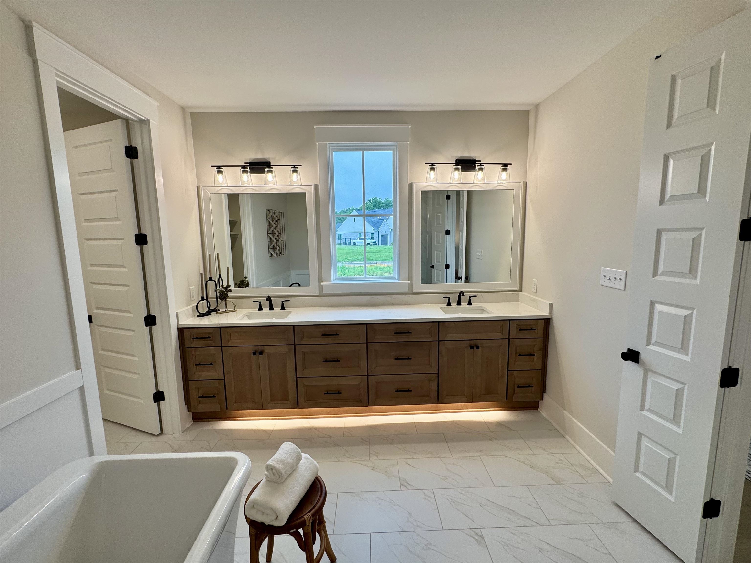 20 Rambling Rex Trail Piperton, TN 38017 - Photo 20 of 31 a spacious bathroom with a tub sink and mirror