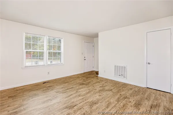 an empty room with windows