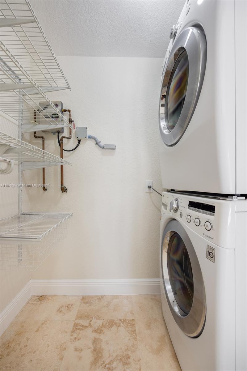 3204 Bird Avenue, Unit 108 Coconut Grove, FL 33133 - Photo 17 of 19 a utility room with dryer and washer