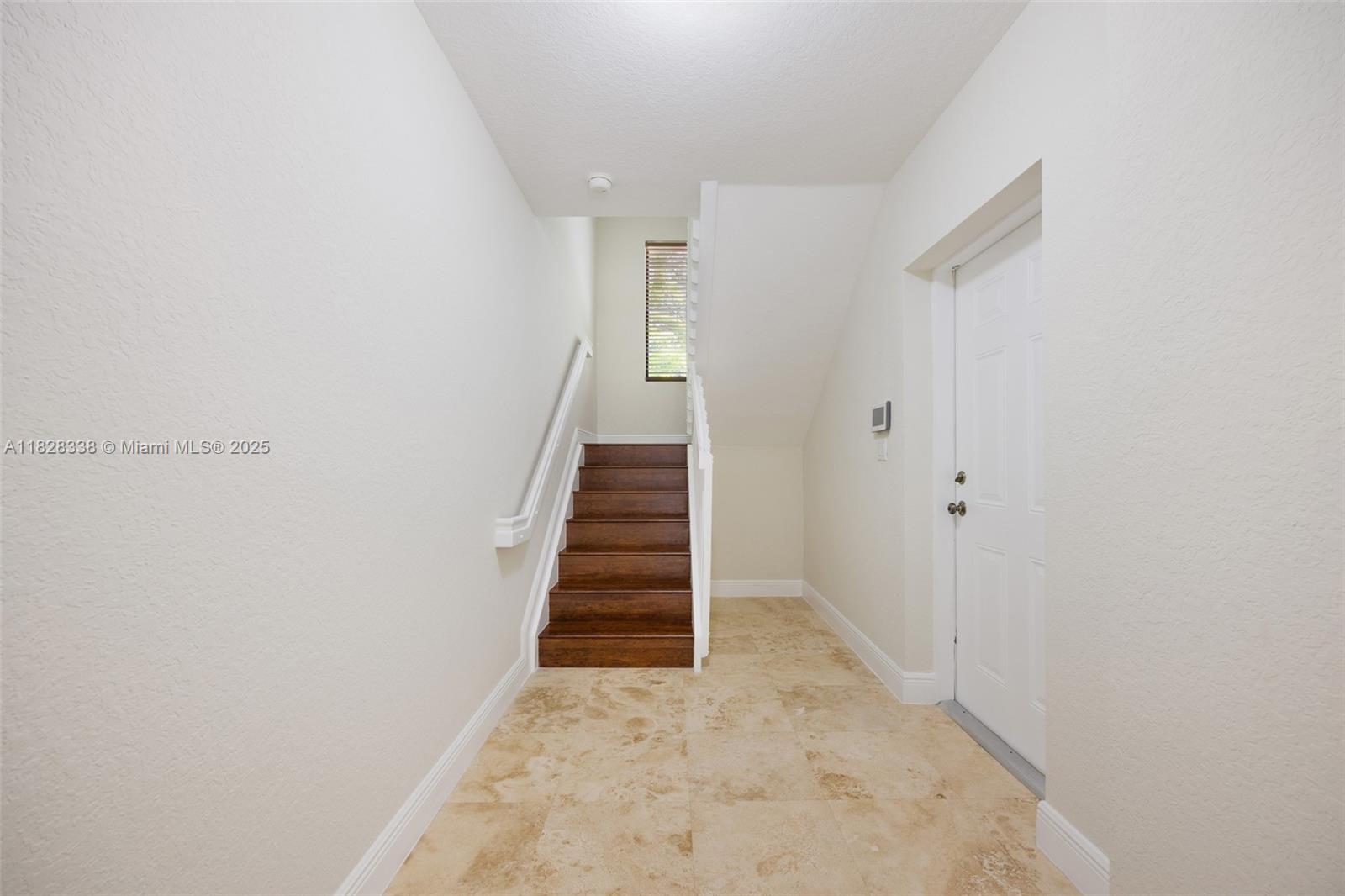 3204 Bird Avenue, Unit 108 Coconut Grove, FL 33133 - Photo 7 of 19 a view of a hallway with staircase