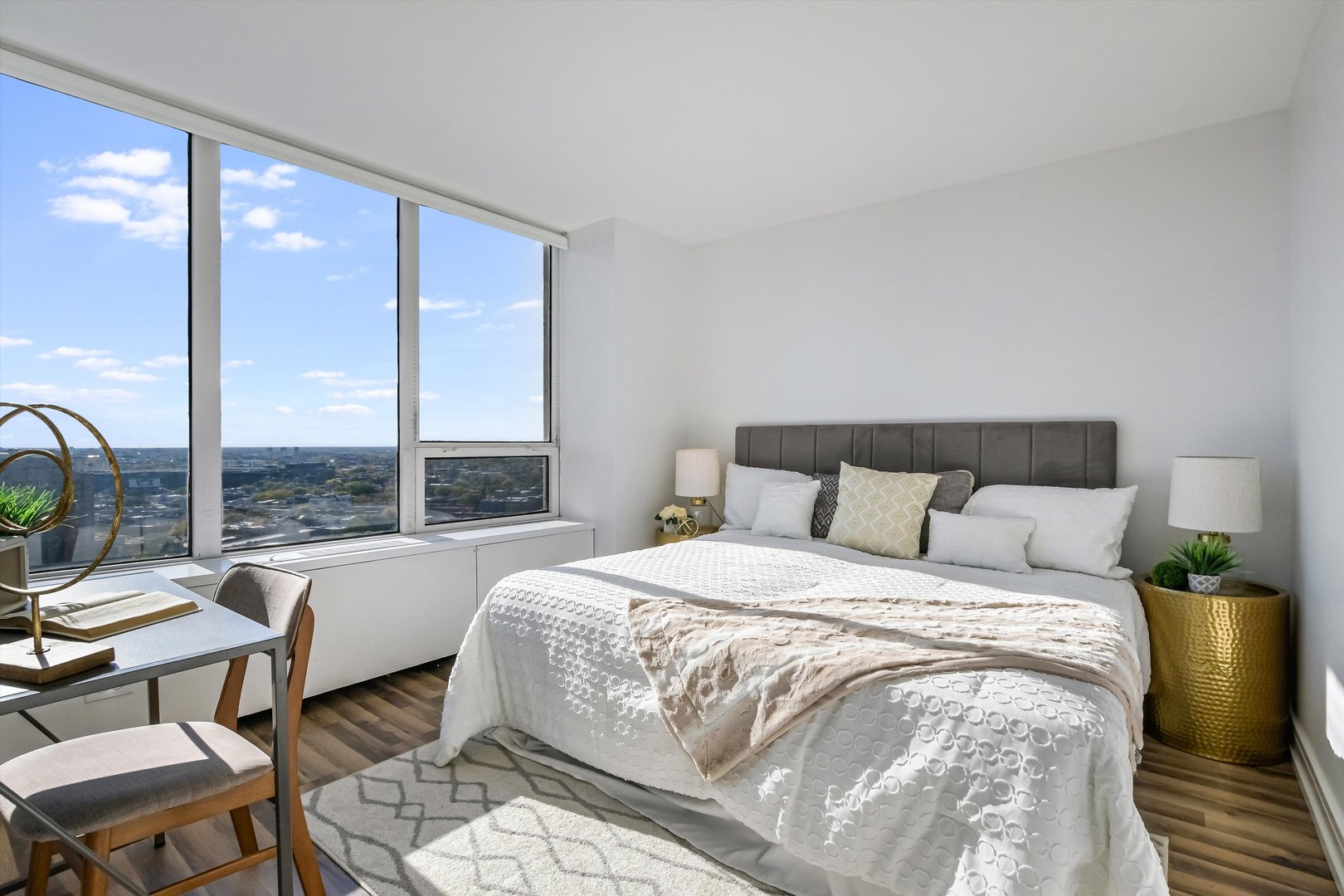 3930 North Pine Grove Avenue, Unit 2308 Chicago, IL 60613 - Photo 11 of 29 a large bedroom with a bed and glass window