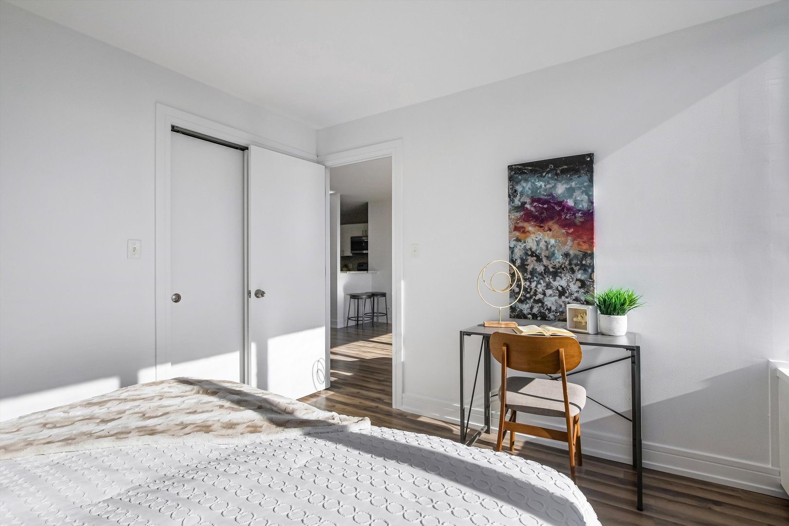 3930 North Pine Grove Avenue, Unit 2308 Chicago, IL 60613 - Photo 12 of 29 a bedroom with a bed and a table in it